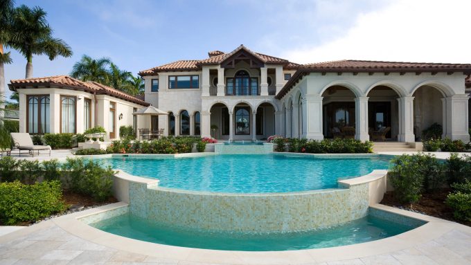 Large estate with swimming pool, representing Senstar's relevance to wealthy homeowners